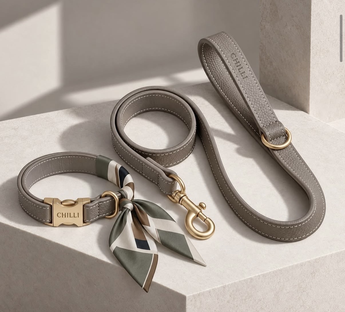 A taupe CHILLI collar, lead and wrist strap styled with a silk scarf