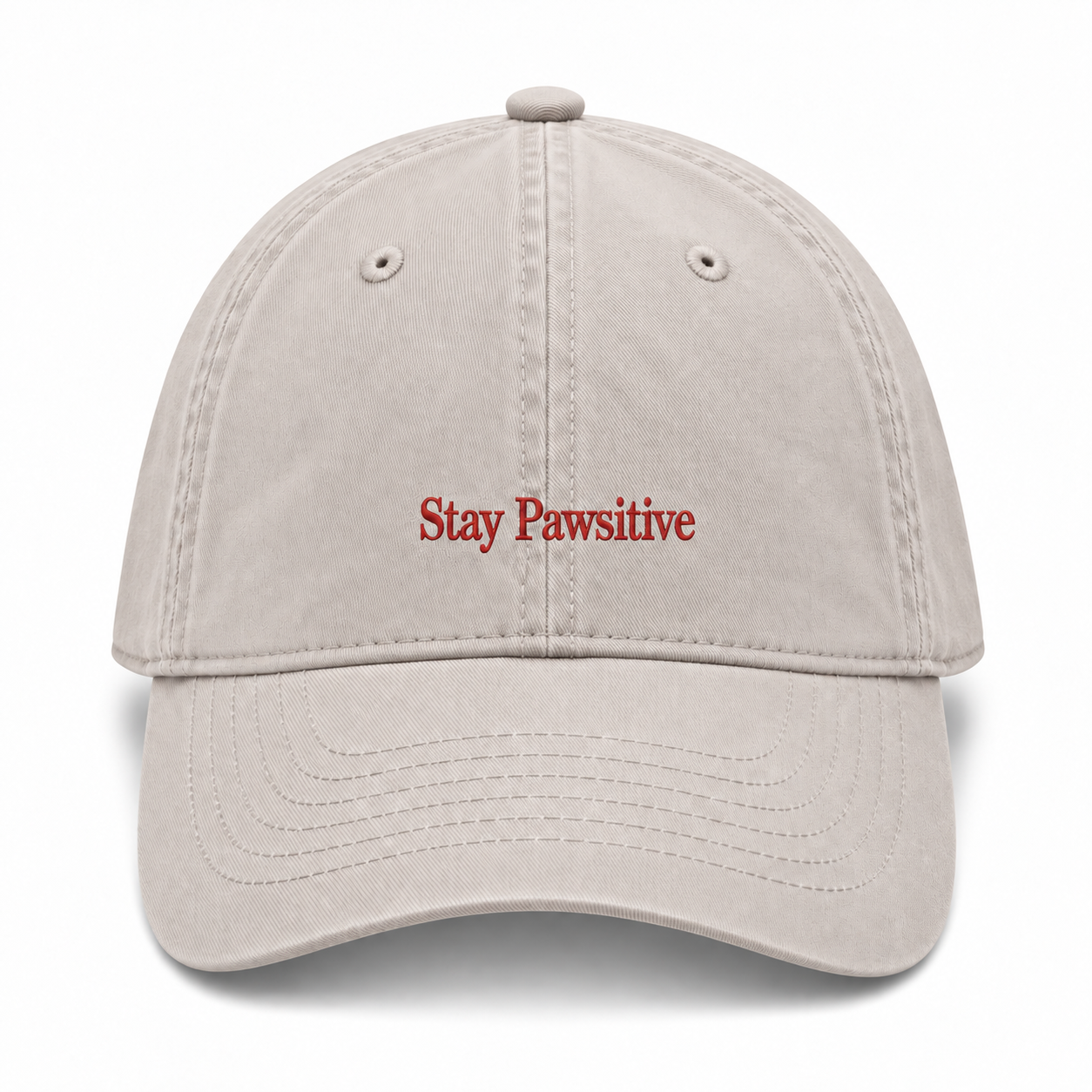 A washed cotton baseball cap embroidered with Stay Pawsitive in red