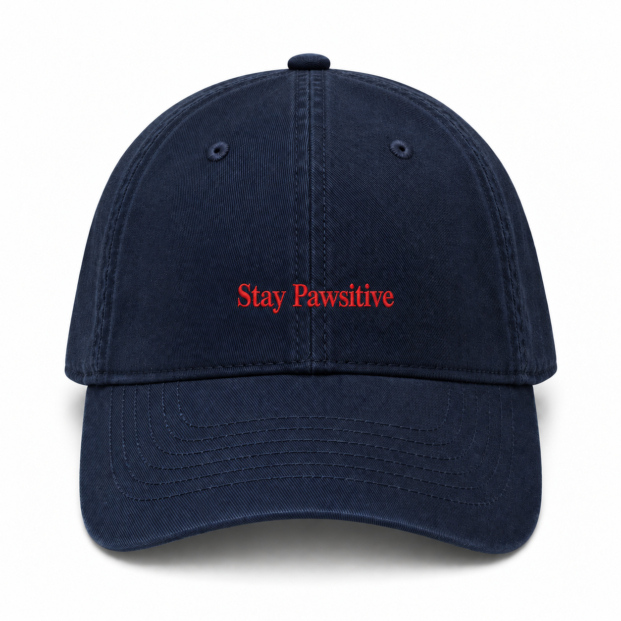 A washed cotton baseball cap embroidered with Stay Pawsitive in red